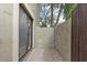 An outdoor patio shows a sliding glass door with a gravel area, offering privacy and space at 3309 N 70Th St # 108, Scottsdale, AZ 85251