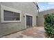 Tiled patio area with plants, sliding glass door access to the interior at 3309 N 70Th St # 108, Scottsdale, AZ 85251