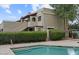 Exterior view of property near a community pool, featuring hedges and a stairwell at 3309 N 70Th St # 108, Scottsdale, AZ 85251