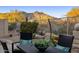 Landscaped backyard patio with desert plants, seating, and mountain views at 34423 N 68Th Way, Scottsdale, AZ 85266