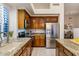 Modern kitchen with stainless steel appliances, granite countertops, and ample cabinet space at 34423 N 68Th Way, Scottsdale, AZ 85266