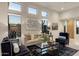 Bright and airy living room with stylish decor, contemporary furnishings, and large windows at 34423 N 68Th Way, Scottsdale, AZ 85266