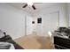 Bright bedroom with closet and neutral carpet, offering a calm and inviting space with an open door at 3519 S 185Th Dr, Goodyear, AZ 85338