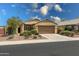 Charming home showcasing a well-maintained front yard and attached two-car garage, perfect for suburban living at 3519 S 185Th Dr, Goodyear, AZ 85338