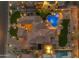 An aerial view reveals an estate home, manicured landscaping, a swimming pool with spa, and a sports court at 3616 E Kachina Dr, Phoenix, AZ 85044