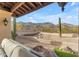 Inviting back patio featuring desert landscaping and mountain views at 3616 E Kachina Dr, Phoenix, AZ 85044