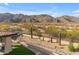 Elevated view of the backyard showcasing desert landscaping and mountain views at 3616 E Kachina Dr, Phoenix, AZ 85044