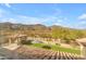 Scenic view from the home of the backyard with a pergola and mountain views at 3616 E Kachina Dr, Phoenix, AZ 85044