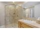 Modern bathroom featuring a glass-enclosed shower and a vanity sink with granite countertops at 3616 E Kachina Dr, Phoenix, AZ 85044