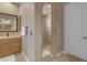 Bathroom featuring a vanity, a glass door shower, and neutral paint at 3616 E Kachina Dr, Phoenix, AZ 85044