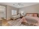 Cozy bedroom featuring two twin beds, a plush rug, and ample natural light from shuttered windows at 3616 E Kachina Dr, Phoenix, AZ 85044