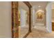 Elegant hallway featuring a large, ornate mirror reflecting the beautiful architecture and design at 3616 E Kachina Dr, Phoenix, AZ 85044