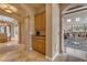 Hallway with stone archways leads to a dry bar, adding architectural charm at 3616 E Kachina Dr, Phoenix, AZ 85044