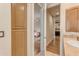 Bright hallway with hardwood floors, showcasing the home's open layout and inviting doorways at 3616 E Kachina Dr, Phoenix, AZ 85044