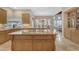 Kitchen island with granite countertop, open to a living and dining space at 3616 E Kachina Dr, Phoenix, AZ 85044