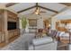 Open-concept living room featuring hardwood floors, neutral tones, and a decorative rug, showcasing modern decor at 3616 E Kachina Dr, Phoenix, AZ 85044