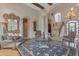 Grand living room with high ceilings, wood floors, decorative arches and staircase, creating an open feel at 3616 E Kachina Dr, Phoenix, AZ 85044