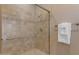 Clean shower stall with tiled walls, glass door, and towel rack at 3616 E Kachina Dr, Phoenix, AZ 85044