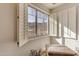 Bright room featuring open plantation shutters with mountain views and a patterned bench at 3616 E Kachina Dr, Phoenix, AZ 85044