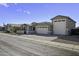 Charming single-story home featuring a three-car garage and paver driveway at 40481 W Desert Fairways Dr, Maricopa, AZ 85138