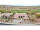 Expansive aerial shot of the home showcasing mature landscaping, desert plants, and golf course views at 42105 N Golf Crest Rd, Anthem, AZ 85086