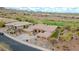 Desert home featuring low-maintenance landscaping, a tile roof, and views of the community at 42105 N Golf Crest Rd, Anthem, AZ 85086