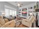 Bright and airy living room with recessed lighting, large windows and comfortable seating at 42105 N Golf Crest Rd, Anthem, AZ 85086