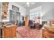 Home office with an ornate oriental rug, large desks and chairs, as well as natural light, and convenient storage at 42105 N Golf Crest Rd, Anthem, AZ 85086