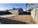 This backyard features a concrete patio area and a freshly graveled space at 4231 E Carter Dr, Phoenix, AZ 85042