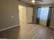 Bedroom featuring a window for natural light and light wood flooring at 4231 E Carter Dr, Phoenix, AZ 85042