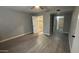 Neutral bedroom with light wood flooring and an ensuite bathroom at 4231 E Carter Dr, Phoenix, AZ 85042