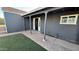 Inviting front porch with brick walkway and updated gray exterior at 4231 E Carter Dr, Phoenix, AZ 85042