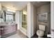 Modern bathroom featuring a combined shower and tub, a wood vanity, and contemporary fixtures for a clean look at 535 W Thomas Rd # 410, Phoenix, AZ 85013