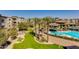 Aerial view of the condo complex featuring a pool, lush landscaping, and well-maintained grounds at 5350 E Deer Valley Dr # 4408, Phoenix, AZ 85054