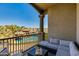 Balcony with outdoor seating and views of the community pool and landscaped grounds at 5350 E Deer Valley Dr # 4408, Phoenix, AZ 85054