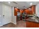 Well-equipped kitchen featuring stainless steel appliances, wood cabinetry, and dark granite countertops at 5350 E Deer Valley Dr # 4408, Phoenix, AZ 85054