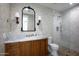 Elegant bathroom with marble countertop, stylish wallpaper and glass enclosed shower at 542 E Hayward Ave, Phoenix, AZ 85020