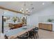 Elegant dining area adjacent to the kitchen, featuring a stylish chandelier at 542 E Hayward Ave, Phoenix, AZ 85020