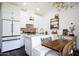 Bright kitchen with breakfast nook, brick backsplash, and modern appliances at 542 E Hayward Ave, Phoenix, AZ 85020