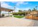 Spacious backyard featuring a covered patio, artificial turf, wooden planter box, and paver patio at 6719 N 10Th Pl, Phoenix, AZ 85014