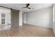 Spacious bedroom featuring wood-look flooring and stylish doorways leading to the bathroom at 6719 N 10Th Pl, Phoenix, AZ 85014