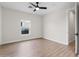 Bright, neutral bedroom with wood-look floors, a ceiling fan, and a window at 6719 N 10Th Pl, Phoenix, AZ 85014