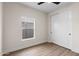 Cozy bedroom with wood floors, a window and a built-in closet at 6719 N 10Th Pl, Phoenix, AZ 85014