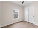 Bright bedroom featuring wood floors and a window, plus a closet for storage at 6719 N 10Th Pl, Phoenix, AZ 85014