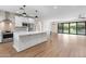 Open concept living space highlighting the bright kitchen with an island and stainless appliances at 6719 N 10Th Pl, Phoenix, AZ 85014