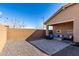 Spacious backyard featuring a covered patio, gravel landscaping, and a block wall for privacy at 7410 S 22Nd Ln, Phoenix, AZ 85041