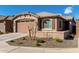 Charming single-story home with desert landscaping and a two-car garage at 7410 S 22Nd Ln, Phoenix, AZ 85041