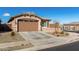 Charming single-story home with a well-maintained front yard and a two-car garage at 7410 S 22Nd Ln, Phoenix, AZ 85041