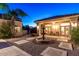 Backyard featuring a water fountain, manicured landscaping, and a patio with seating at 8270 E Corrine Dr, Scottsdale, AZ 85260