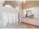 Bright bathroom with a large mirror, granite counters, and ample cabinet space at 8270 E Corrine Dr, Scottsdale, AZ 85260